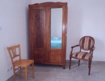 a wooden chair in a room